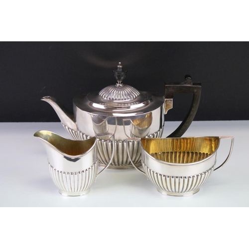 663 - Edwardian three piece silver tea service comprising teapot, milk jug and sugar bowl, gadrooning to t... 