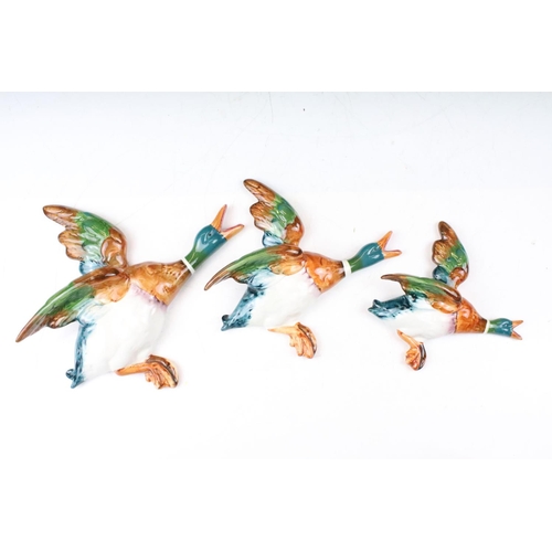 13 - Set of three Beswick flying duck wall plaques all with hand painted details. Impressed marks to vers... 