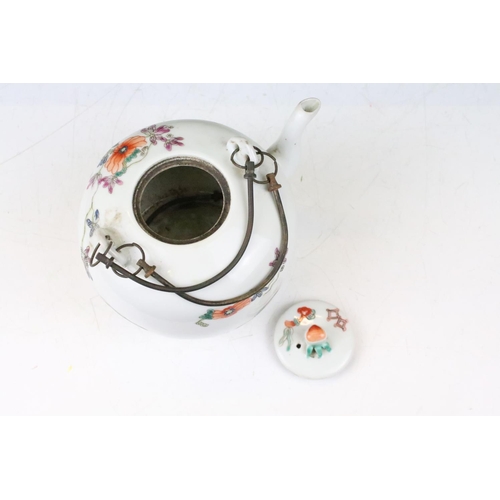 16 - Chinese teapot having enamelled vase detailing to the sides with floral sprays, with twin metal hand... 