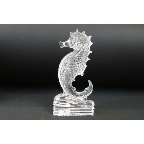 18 - Four Waterford crystal boxed cut glass paperweights and ornaments to include a sea horse ornament, h... 