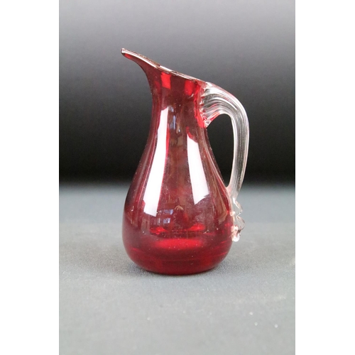 19 - Four pieces of Whitefriars ruby glass to include a lobed control bubble vase, control bubble vase, d... 