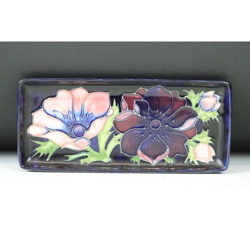 6 - Four Moorcroft ceramic framed mounted ceramic lids to include a hibiscus pattern plaque, two clemati... 