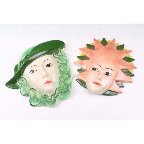 28 - Two Crown Devon pottery wall masks, painted by Dorothy Ann, measure approx 24.5cm high