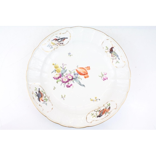 29 - 18th Century Meissen deep circular dish with central floral sprays, the moulded border with four orn... 