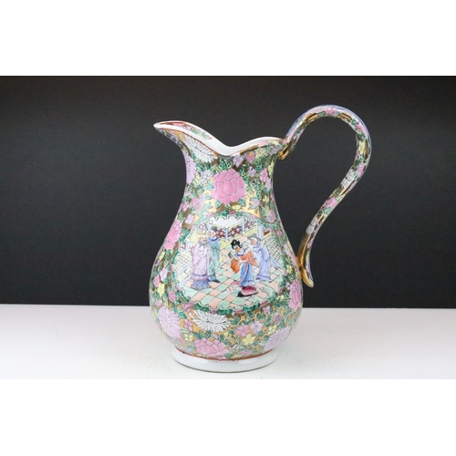 31 - 20th Century Famille Rose wash jug and bowl, decorated with figural panels and flowers, on a gilt gr... 