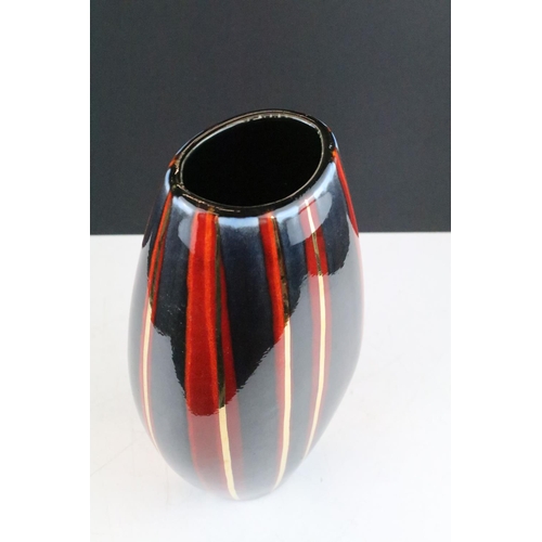 33 - Poole Pottery vase of flattened baluster form, with gilt, blue & red striped design, monogram to bas... 