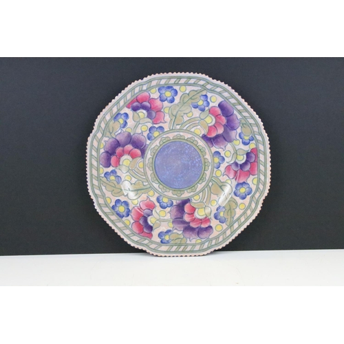 37 - Charlotte Rhead for Crown Ducal shaped circular plate, tube lined with stylised flowerheads, blue da... 