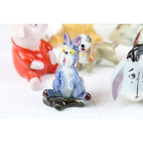 83 - Collection of Wade and other ceramic figures to include Disney figures, Beswick musical cats, wade D... 