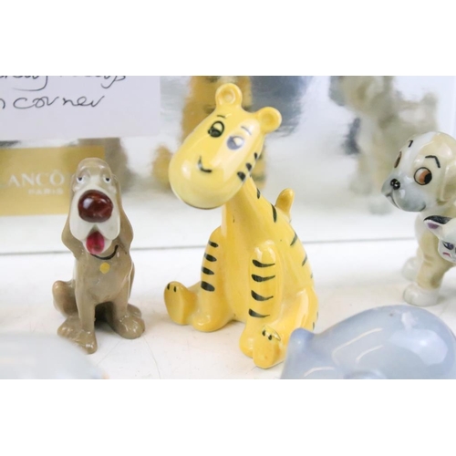 83 - Collection of Wade and other ceramic figures to include Disney figures, Beswick musical cats, wade D... 