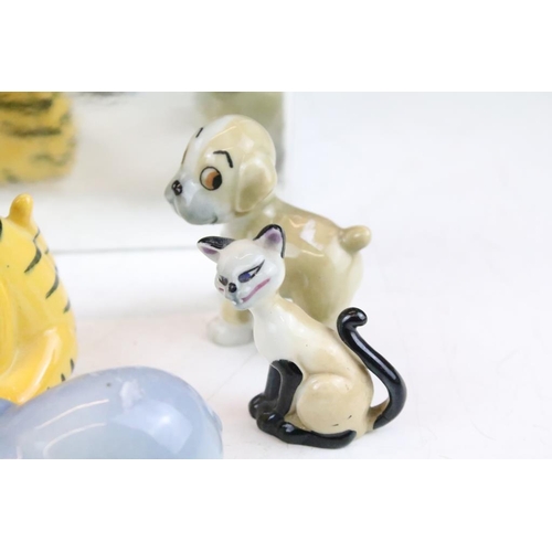 83 - Collection of Wade and other ceramic figures to include Disney figures, Beswick musical cats, wade D... 