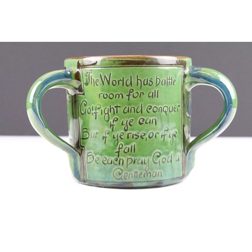 64 - Early 20th Century C H Brannam Barum tyg three handled loving cup having engraved with verso / motto... 