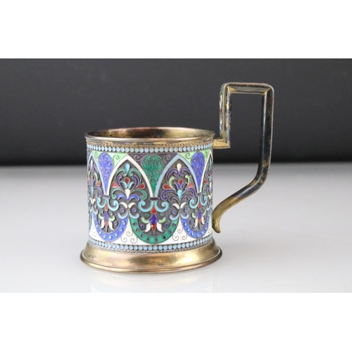 661 - Early 20th Century Russian silver cloisonné enamelled cup. The cup having a footed base with stirrup... 