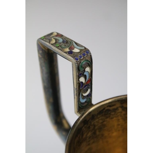 661 - Early 20th Century Russian silver cloisonné enamelled cup. The cup having a footed base with stirrup... 