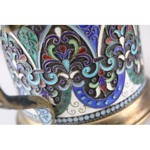 661 - Early 20th Century Russian silver cloisonné enamelled cup. The cup having a footed base with stirrup... 