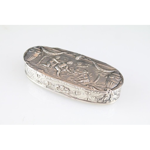 805 - German silver snuff pill box of oval form with neo classical cherubs and urns to the lid (marked wit... 