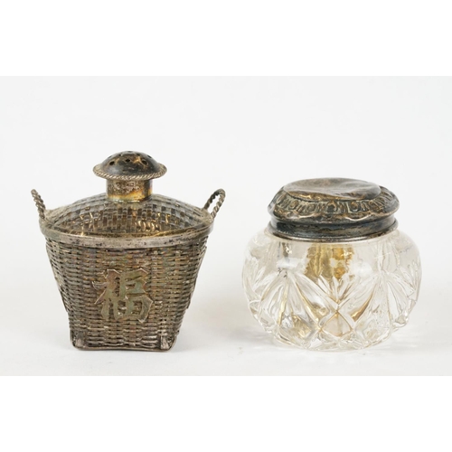 219 - Three Chinese white metal salts / pepperettes with character marks to base together with a cut glass... 