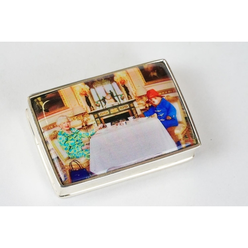 220 - Silver Pill Box with enamel lid depicting Paddington Bear and Queen Elizabeth II taking tes