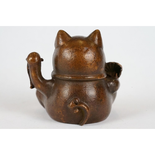 221 - An ornamental Japanese bronze 招き猫 / maneki-neko (waving / beckoning) lucky cat talisman.