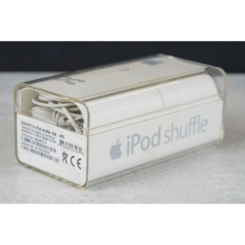 224 - A collection of Apple Ipods to include the shuffle complete with accessories.