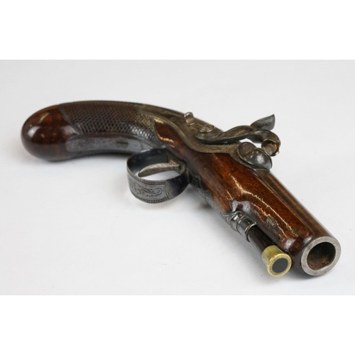 227 - An antique percussion travelling pistol by Trulock & Son of Dublin.