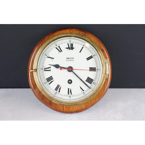 121 - Smiths Astral brass bulkhead nautical ships clock, with bevelled glass front, the cream dial with bl... 