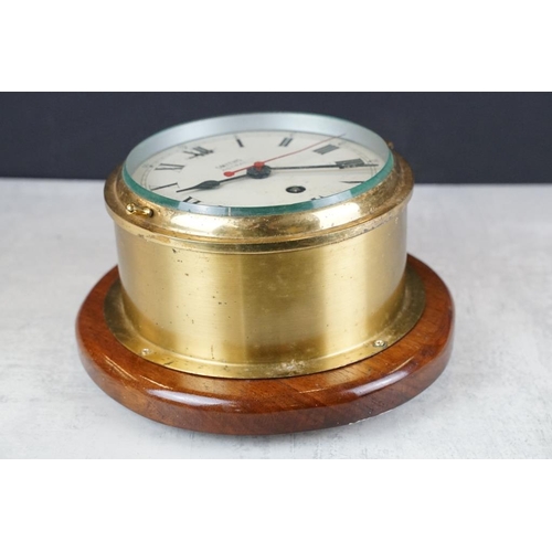 121 - Smiths Astral brass bulkhead nautical ships clock, with bevelled glass front, the cream dial with bl... 