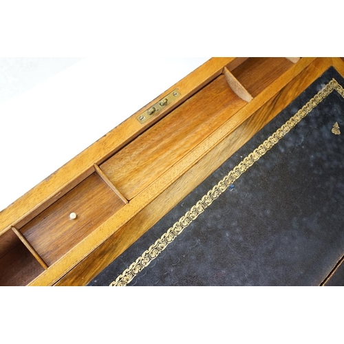 123 - 19th century brass bound burr walnut writing slope, opening to a lined slope and typical storage com... 