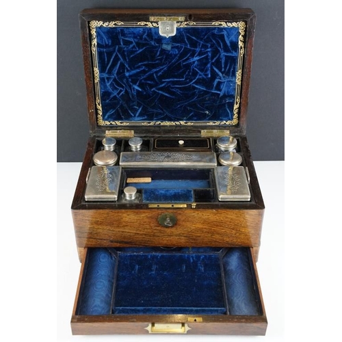 124 - Victorian rosewood vanity box, the fitted interior with various glass jars with silver plated lids, ... 