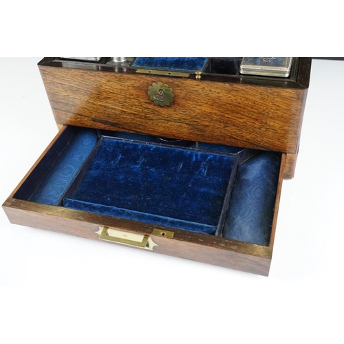 124 - Victorian rosewood vanity box, the fitted interior with various glass jars with silver plated lids, ... 