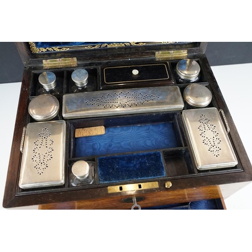 124 - Victorian rosewood vanity box, the fitted interior with various glass jars with silver plated lids, ... 