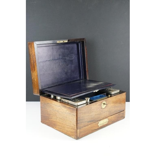 124 - Victorian rosewood vanity box, the fitted interior with various glass jars with silver plated lids, ... 