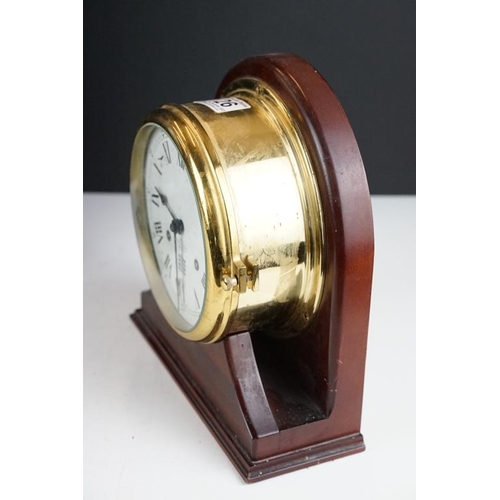 126 - Brass cased nautical bulkhead ships clock (23.5cm high), together with a Victorian slate mantel cloc... 