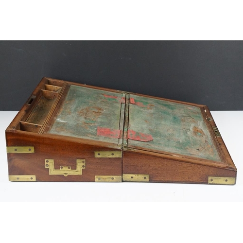 128 - 19th Century campaign style brass-bound mahogany writing slope, with twin inset handles, the interio... 