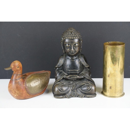 129 - Cast bronze figure of a Thai seated Buddha (approx 21cm high), together with a WW1 brass trench art ... 