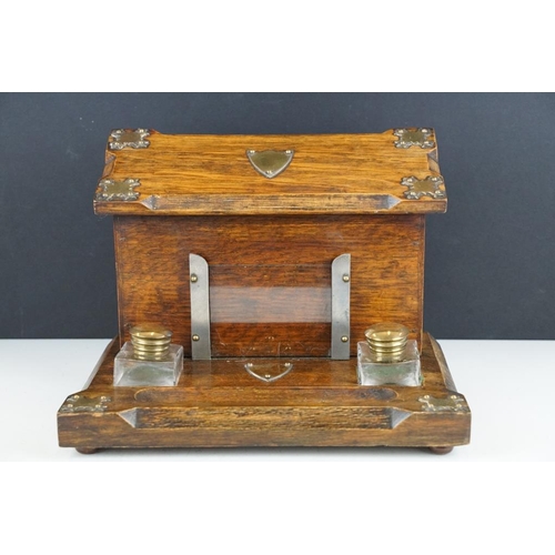 130 - Late 19th / early 20th century oak double inkwell desk stand with letter box, the glass inkwells wit... 