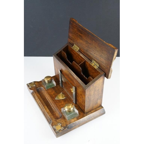 130 - Late 19th / early 20th century oak double inkwell desk stand with letter box, the glass inkwells wit... 