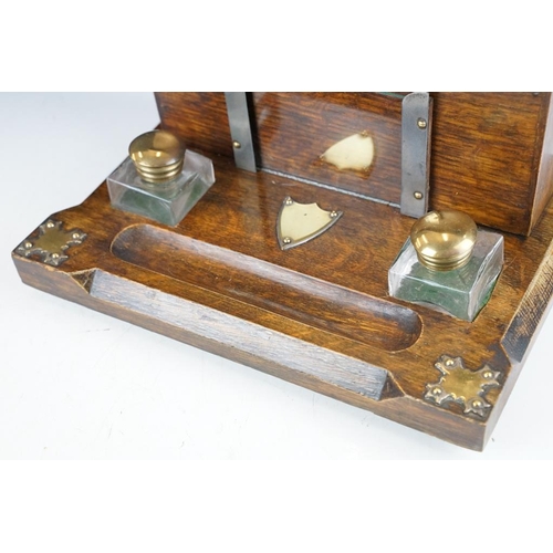 130 - Late 19th / early 20th century oak double inkwell desk stand with letter box, the glass inkwells wit... 