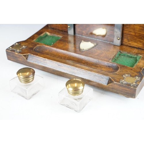 130 - Late 19th / early 20th century oak double inkwell desk stand with letter box, the glass inkwells wit... 