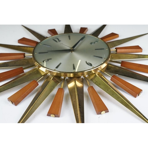 132 - Mid 20th C Metamec brass & teak sunburst wall clock, the silvered dial with applied Arabic numerals.... 