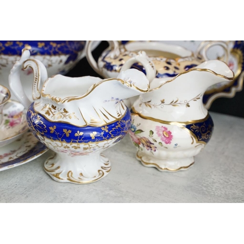 92 - 19th century tea ware with floral decoration & cobalt blue glazing on a white ground, to include tea... 