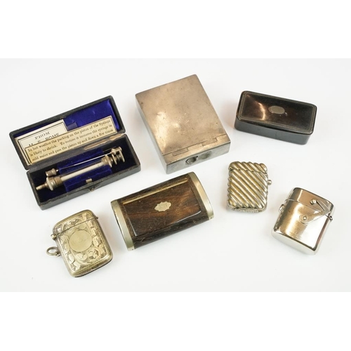 222 - A small group of mixed collectables to include a pocket syringe, vesta cases and snuff boxes.