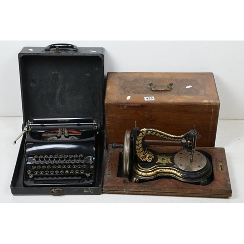 436 - Victorian cast iron table top sewing machine with typical gilt decoration, approx 36cm long, wooden ... 