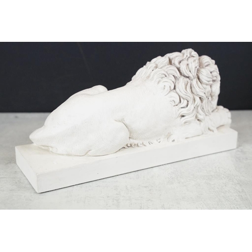 428 - After Antonia Canova (1757-1822) - A reconstituted stone washed figure of a lion (32cm long), togeth... 