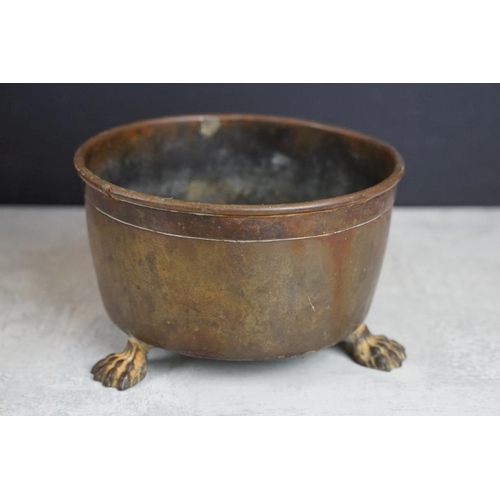 432 - Copper planter with twin lion mask handles (27cm long), together with a brass planter with embossed ... 