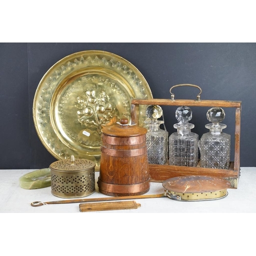 434 - Late 19th / early 20th century oak tantalus with silver plated mounts, housing three cut glass decan... 