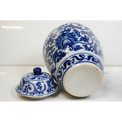 48 - Pair of 20th century Chinese style blue and white vases & covers, of ovoid form, with underglaze flo... 