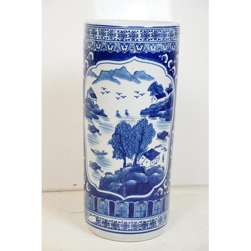 50 - 20th Century Chinese blue & white pottery stick stand, of cylindrical form, decorated with mountain ... 