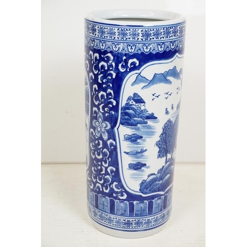 50 - 20th Century Chinese blue & white pottery stick stand, of cylindrical form, decorated with mountain ... 