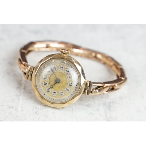 573 - 9ct gold cased wristwatch, gilt dial, Arabic numerals, black poker hands, 9ct gold expandable bracel... 