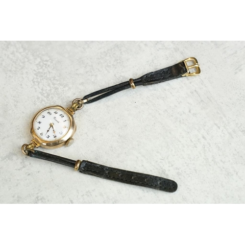 575 - 9ct gold cased ladies watch, white enamel dial, black Arabic numerals, poker hands, diameter approx ... 